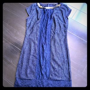 Navy dresss with necklace detail.